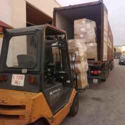 Loading pallets with a forklift at our warehouse
